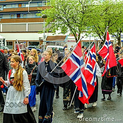 Young Girls or Schoolgirls in Traditional Dress Carrying Flags In Norwegian Independence Day Parade Editorial Stock Photo