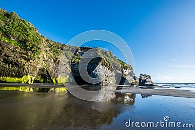 Sandstone cliffs at the Three Sisters beach in the Tongaporutu in New Zealand Stock Photo