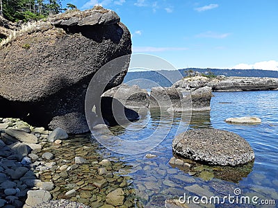 Sandstone rock formations along the shoreline Stock Photo