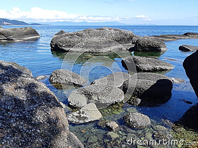 Sandstone rock formations along the shoreline Stock Photo