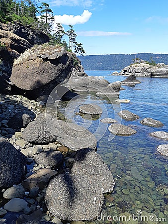 Sandstone rock formations along the shoreline Stock Photo