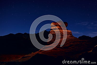 Sandstone rock is illuminated by a flashlight in Herman Cav Canyon at night. South Gobi, Mongolia. Herman Tsav, Martian landscape Stock Photo