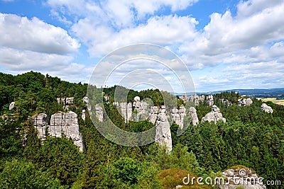 Sandstone rock towers in green forest area Stock Photo
