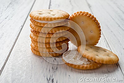 Sandwich biscuits with white cream filling on white wood Stock Photo