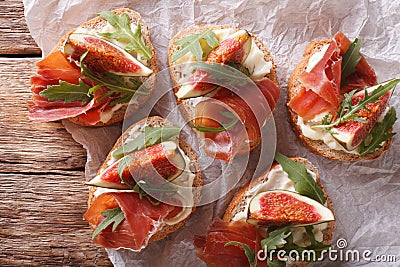 Sandwich with figs, ham and cream cheese close-up. Horizontal to Stock Photo
