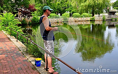 Sandwich, MA: Man Fishing in Grist Mill Pond Editorial Stock Photo