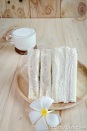 Sandwich with milk on wood background Stock Photo