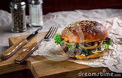 Sandwich with ostrich burger, onion, sauce and lettuce Stock Photo