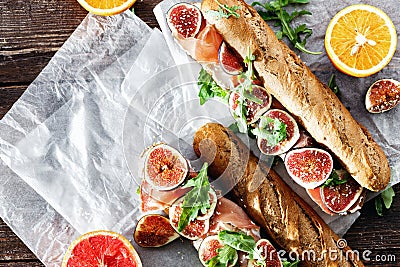 Sandwich prosciutto mascarpone cheese figs wine top view copy space Stock Photo