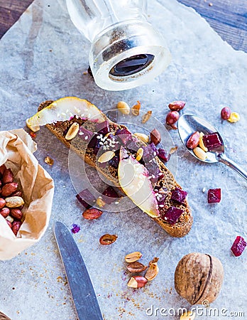 Sandwich with roasted beets, nuts, pear and sesame Stock Photo