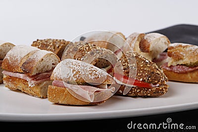 Sandwiches cutted into peaces with different breads and fillings Stock Photo