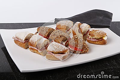 Sandwiches cutted into peaces with different breads and fillings Stock Photo