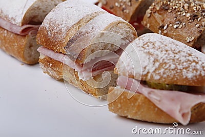 Sandwiches cutted into peaces with different breads and fillings Stock Photo