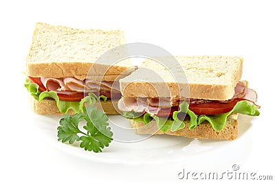 Sandwiches with lettuce,tomato,cold cuts with parsley on white Stock Photo