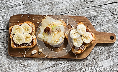 Sandwiches with peanut-butter and banana and sandwiches with soft cheese, pear and honey Stock Photo