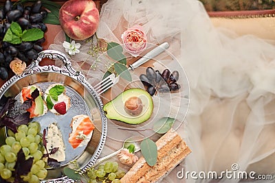 sandwiches and sweets. buffet, healthy fruit Wedding details. Snacks and sweets for guests. Wedding reception. Tasty food. Holiday Stock Photo