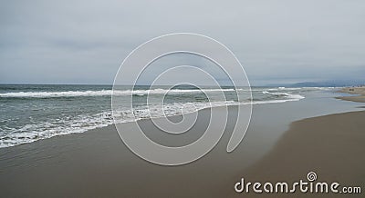 Sandy beach with gentle waves, Pacific Ocean Stock Photo