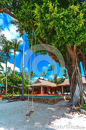 Sandy beach, house, tree Stock Photo