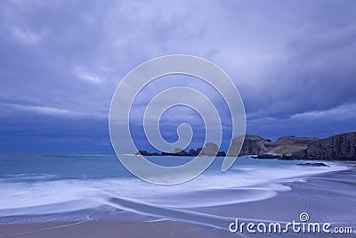Sandy beach under cloudscape Stock Photo