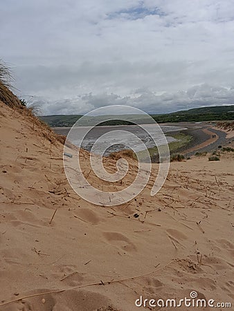 Sandy coast beach on a calm day Stock Photo