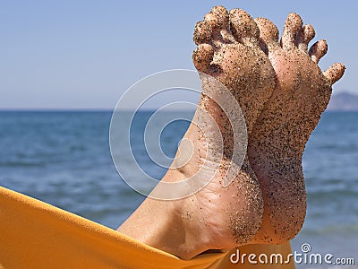 Sandy crazy woman toes on the beach Stock Photo