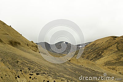 A sandy mountain hills with snow rocks Stock Photo