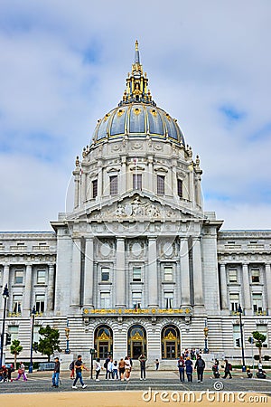 Sandy path with pedestrians on sidewalk looking up at massive city hall entrance Editorial Stock Photo