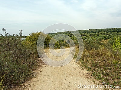 Sandy rural road near the river Stock Photo