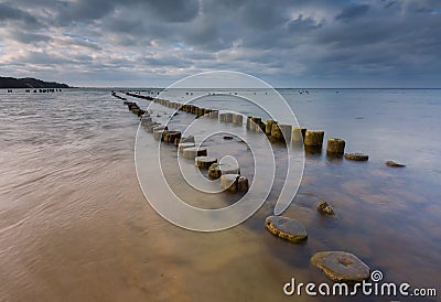 Sandy shore of Baltic sea and torpedownia near Gdynia. Stock Photo