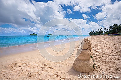 sandy woman on Lanikai Beach and Mokulua Islands, O'ahu, Hawai'i Stock Photo