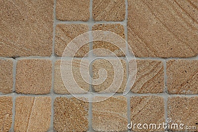 Sandy Yellow stone wall Stock Photo