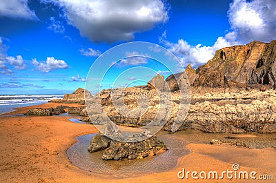 Sandymouth beach North Cornwall England UK beautiful rocks with unusual patterns in colourful HDR Stock Photo