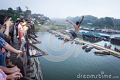 SANGKHLABURI, THAILAND - DECEMBER 27, 2015: Asia young boy jump Editorial Stock Photo