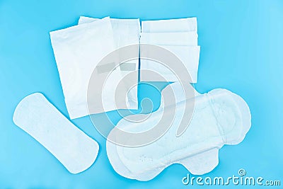 Sanitary pads and absorbent sheets on a blue background Stock Photo