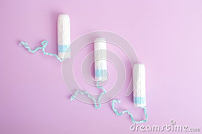 Sanitary tampon isolated on pink background. Beauty and hygiene concept Stock Photo