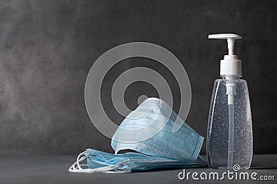 Sanitizer gel or antibacterial soap and face mask for coronavirus preventive measure Stock Photo