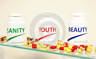 Sanity, Beauty and Youth pills in a bottle Stock Photo