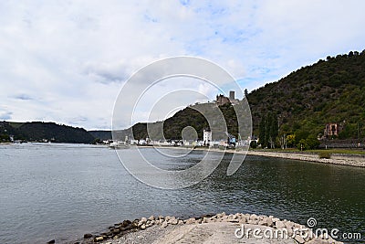 Sankt Goarshausen, Germany - 09 30 2021: ntry to Lorelei passage with a passenger ship, waterfront of Sankt Goarshausen, Burg Katz Stock Photo