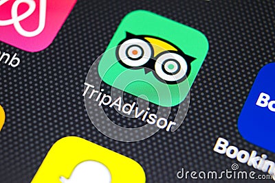 Tripadvisor application icon on Apple iPhone X screen close-up. Tripadvisor.com app icon. Tripadvisor is an online travel website. Editorial Stock Photo