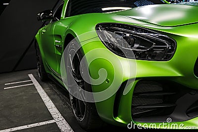 Green Mercedes-Benz AMG GTR 2018 V8 Biturbo exterior details, Headlight. Front view. Car exterior details Editorial Stock Photo