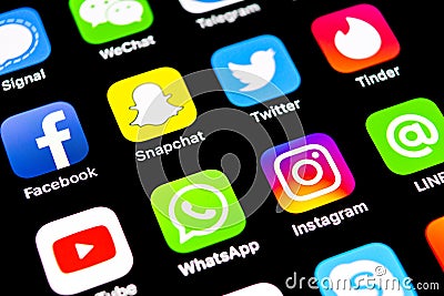 Apple iPhone X with icons of social media facebook, instagram, twitter, snapchat, google application on screen. Social media icons Editorial Stock Photo