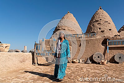 Sanli Urfa, Turkey- September 12 2020: Tourists posing in local clothes in front of harran houses Editorial Stock Photo