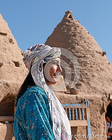 Sanli Urfa, Turkey- September 12 2020: Tourists posing in local clothes in front of harran houses Editorial Stock Photo