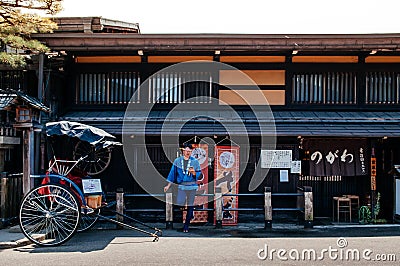 Sanmachi Suji old Edo Takayama with Japanese pulled rickshaw and Editorial Stock Photo