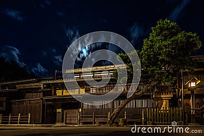Sannomachi Street with buildings on it surrounded by lights during the night in Takayama, Japan Stock Photo