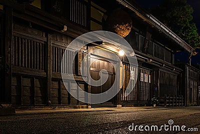 Sannomachi Street with buildings on it surrounded by lights during the night in Takayama, Japan Stock Photo