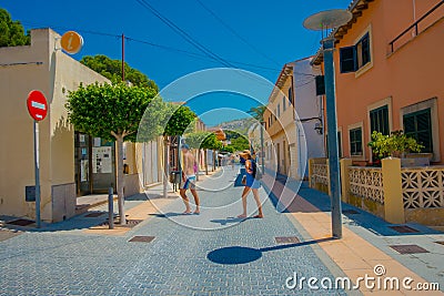 SANT ELM, MALLORCA, SPAIN - AUGUST 18 2017: Unidentified people walking at Sant Elm City, quaint shopping street in the Editorial Stock Photo