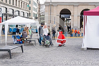 Santa and angel on square in Zurich Editorial Stock Photo