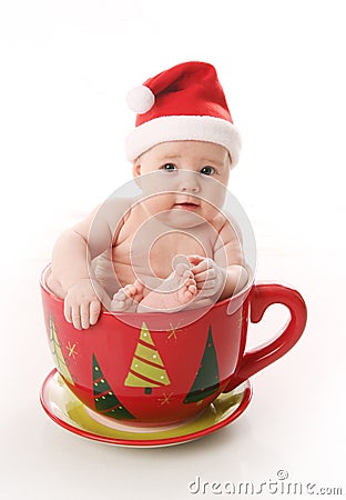 Santa baby in a large mug Stock Photo