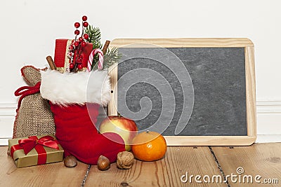 Santa boots and blackboard Stock Photo